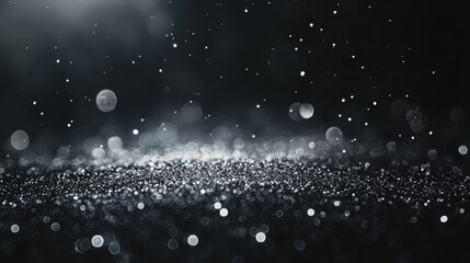 Dark background with silver glitter and bokeh. Perfect for elegant designs, adding sparkle and luxury.