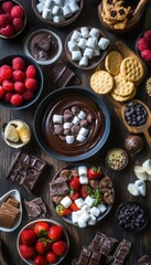 Sweet chocolate fondue with marshmallows, strawberries, and cookies.