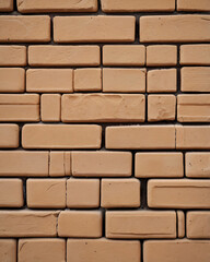 Obraz premium The brick wall's bricks have a slightly weathered appearance.