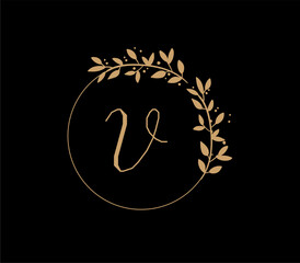 The logo has an elegant and classic design, with the main element being a monogram of the initials, such as the letters A and B, written using a calligraphy or serif font with fine details. The gold c