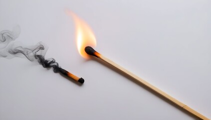 Burning match and extinguished match on white background.