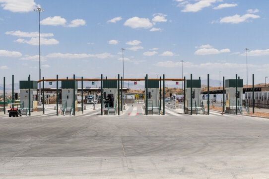 U.S.-Mexico border inspection lanes with automated systems and green-arrow signals at the Nogales-Mariposa Port of Entry customs checkpoint in Nogales, Arizona, ensuring efficient vehicle processing