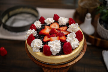 Delicious strawberry cheesecake on display at a cozy dessert shop during the afternoon