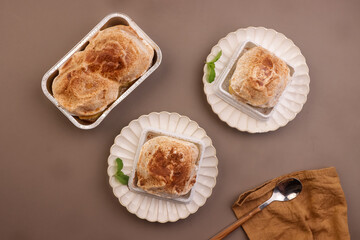 Thai Milk Buns are a Bread from Thailand which one Soft, Fluffy, Filled with Milk Cream and Topped with Powdered Milk and Sugar. 