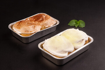 Thai Milk Buns are a Bread from Thailand which one Soft, Fluffy, Filled with Milk Cream and Topped with Powdered Milk and Sugar. 