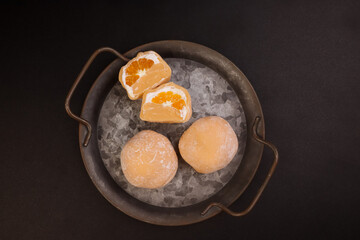 Orange Traditional Japanese Daifuku Mochi Dessert. 