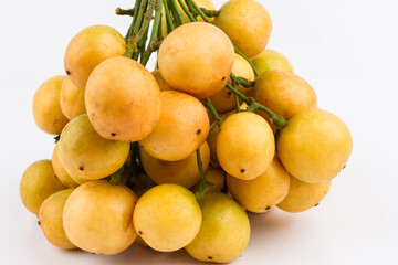 close up of baccaurea ramiflora on white background