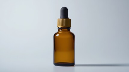 Amber Glass Dropper Bottle with Black Lid Against a Soft, Neutral Background for Essential Oils, Serums, and Other Liquid Products in a Minimalist Style