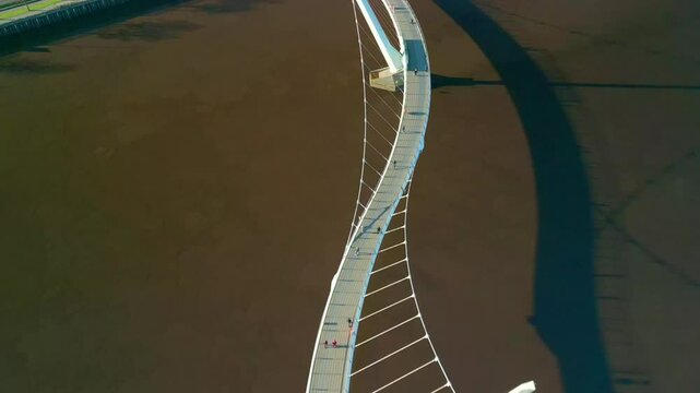 Overhead aerial shot of the Peace Bridge in Derry-Londonderry, NI. Filmed in 4K at 60fps and in Rec709 color space.