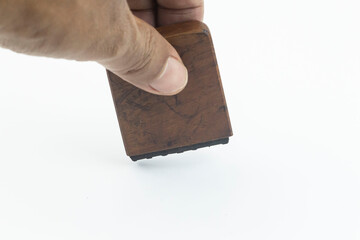 hand holding a stamp