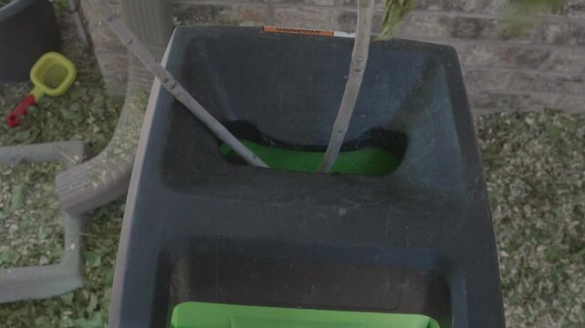 POV Putting Branch Into Wood Chipper