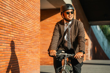 Asian businessman riding bike in city. sustainable save energy lifestyle. Commute and carbon...