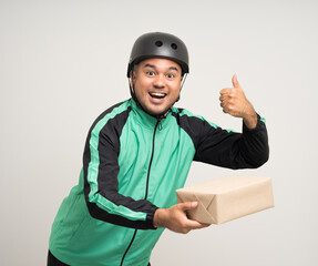 Young asian rider wearing green jacket uniform and bike helmet various action holding paper parcel box delivery to customer. Delivery man service worker Courier and shipping parcel cardboard service.