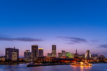sweet sunset winter and light illumination from Cityscape of Yokohama city, Skyline and office building and downtown in  Minatomirai Area, Yokohama city port, Kanagawa, Japan