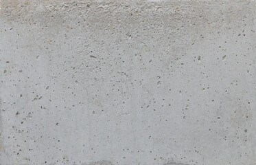 Texture of a gray concrete block, rough and industrial surface, suitable for backgrounds, copy space