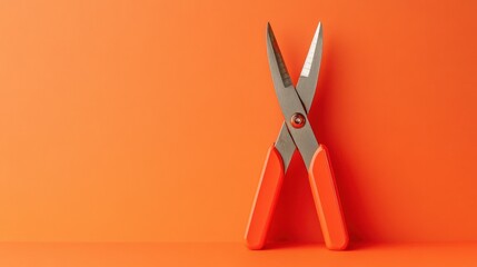 A compact scissor jack, displayed against a warm gradient sunset-orange background.