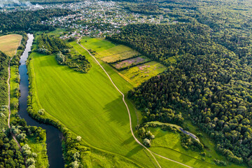 Aerial view of green farm fields in countryside