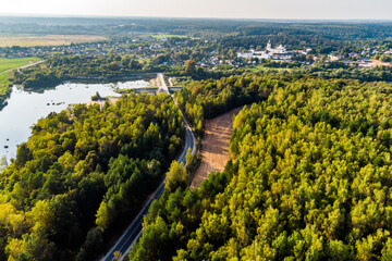 Aerial view of the road leading to a rural development. Borovsk outskirts, Kaluga region, Russia