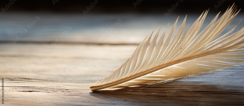 Poster dried palm leaf positioned diagonally on a warm wooden surface with soft lighting creating a serene 
