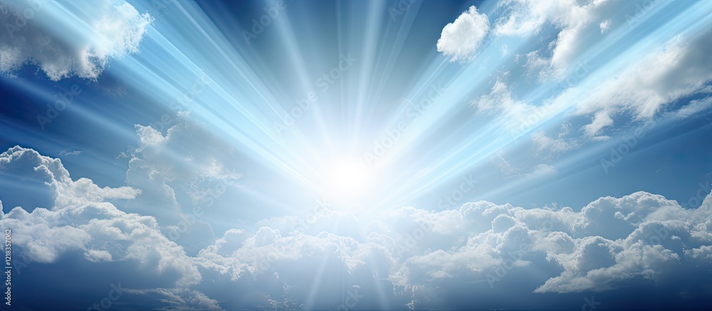 Poster Radiant sunlight breaking through blue skies with soft white clouds in the foreground creating a serene and uplifting atmosphere.