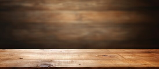 Wooden table surface in warm brown tones against a textured dark brown background creating an inviting space for text or images.
