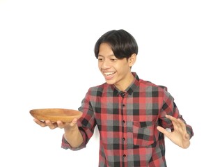 The young Asian man looked at the empty plate he was holding with an excited expression