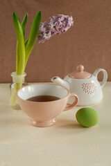 spring tea setup with green easter egg