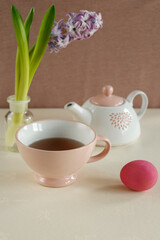 spring tea setup with pink easter egg