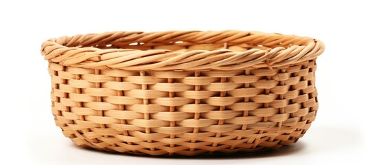 Empty round wicker basket made of bamboo on a white background with a natural tan color and textured weave highlighting craftsmanship and simplicity.
