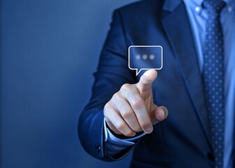 A businessman engages with a virtual screen highlighting a chat bubble icon showcasing the intersection of communication and technology in modern business environments
