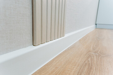 Having a pristine white skirting board next to a beautifully polished wooden floor significantly...