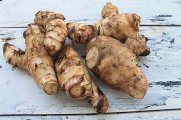 A typical Indonesian food is a type of tuber called midra on a wooden table


