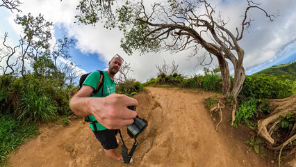 Naklejka premium Hike with me alone the green Maui Waihee Trail which is full green during summer time