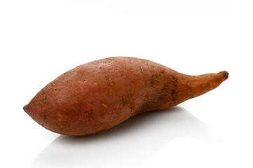 Sweet potato resting on a clean white surface Harvested from fertile ground and perfect for cooking or baking