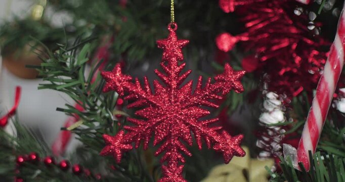 Candy cane and red Christmas glittering ster 4K tilting video