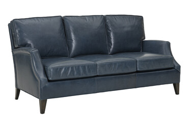 A  leather sofa in a minimalist design with wooden legs + clipping path. The sofa is isolated on a White background.