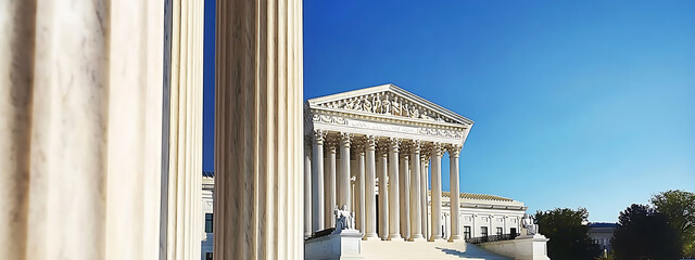 Obraz premium The majestic marble columns of the Supreme Court of the United States, representing justice, authority, and timeless architectural elegance.