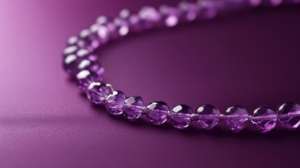 Obraz premium Purple crystal necklace displayed on a rich dark purple background highlighting its elegant design and shine