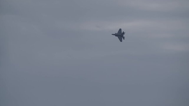 F 35 doing stunts at air show with after burners