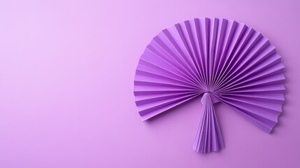Colorful purple paper fan arranged on a soft pastel purple background for a creative art display or decoration idea