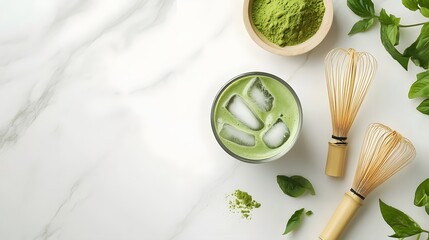 Obraz premium Delightful Iced Matcha Latte on Marble Countertop with Ingredients