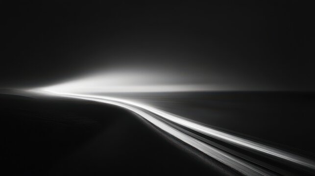 Fototapeta Black and White Night Road Photography Captures Light Trails and Darkness