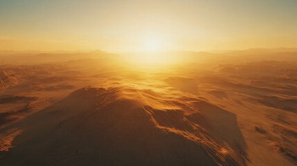 Desert sunset aerial view, dune landscape, hazy mountains, atmospheric, travel