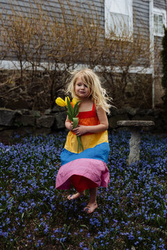 Young girl standing in flowers