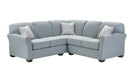 L-shaped sectional sofa with pillows in a minimalist design with wooden legs + clipping path. The corner sofa is isolated on a White background.