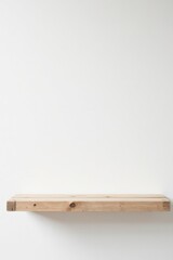A Simple, Rustic, Light-Colored Wooden Shelf Against a Clean White Wall, Perfect for Displaying Various Items or as a Minimalist Design Element