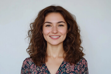 Fototapeta premium Portrait of a beautiful smiling woman isolated on a white background