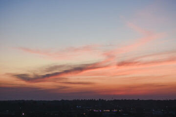 warm-toned orange sky during sunset. The sun is low on the horizon, casting a beautiful and calming...