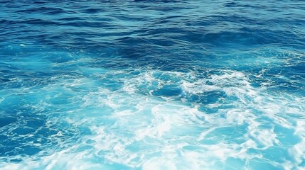 Obraz premium Pure blue turquoise water texture of the ocean sea with foam from and waves