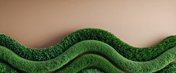 Wave shaped green hedges adding texture on a plain sandy brown background